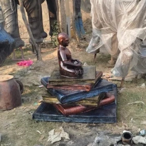 Boy On Books Scultpure