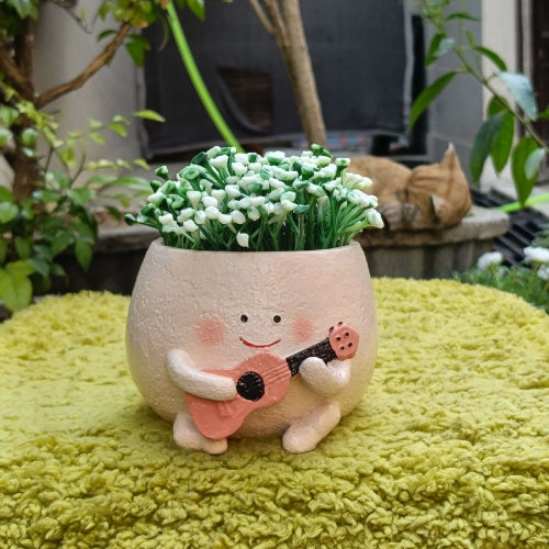 Smiley with guitar planter