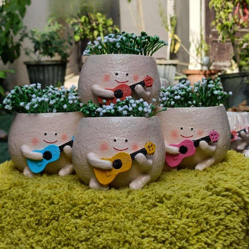 Smiley with guitar planter multiple