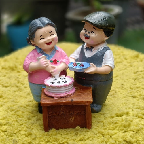 Grandsparents cutting cake