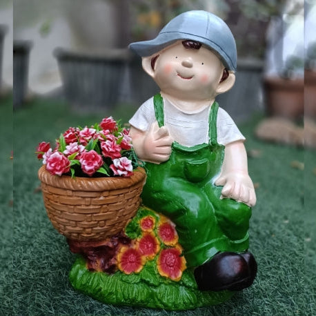 Boy sitting with pot big planter