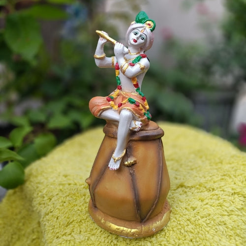 Sitting krishna idol