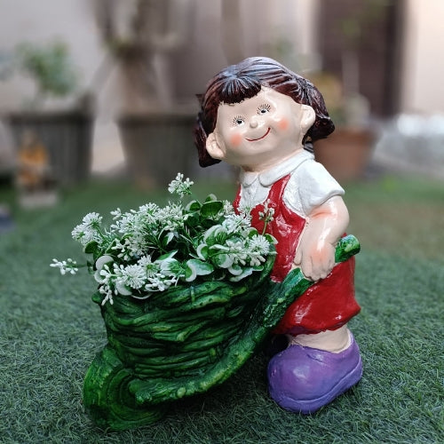 Girl pushing cart big planter