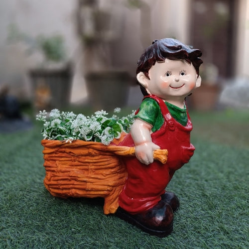 Boy pushing cart big planter