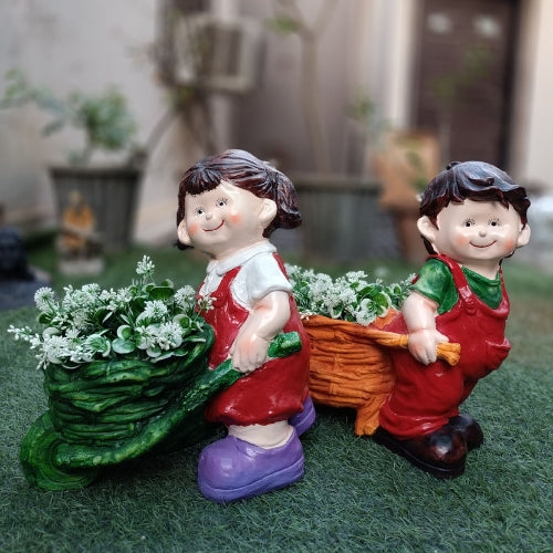 Set of 2 girl boy pushing cart big planter